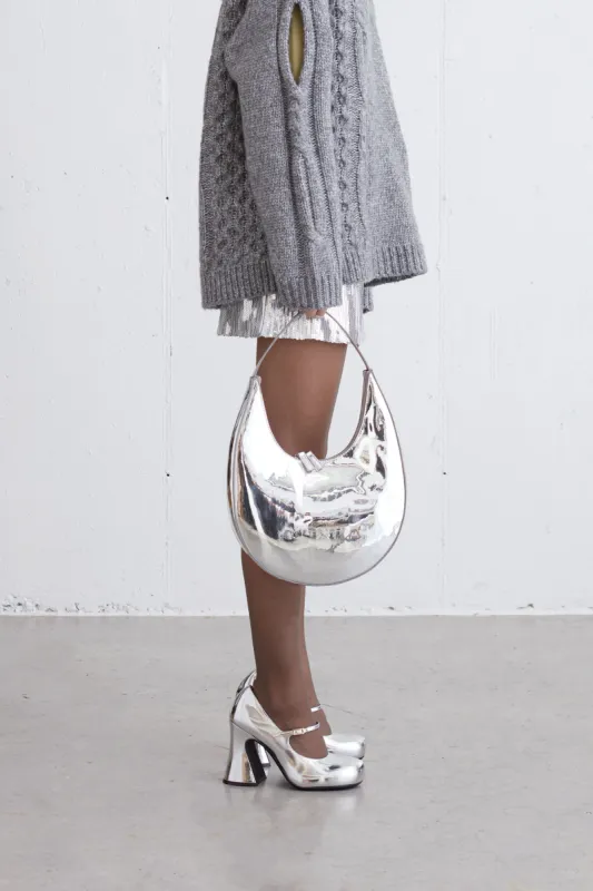 STRUCTURED CURVED SHOULDER BAG IN SILVER sold by OAK AND FORT