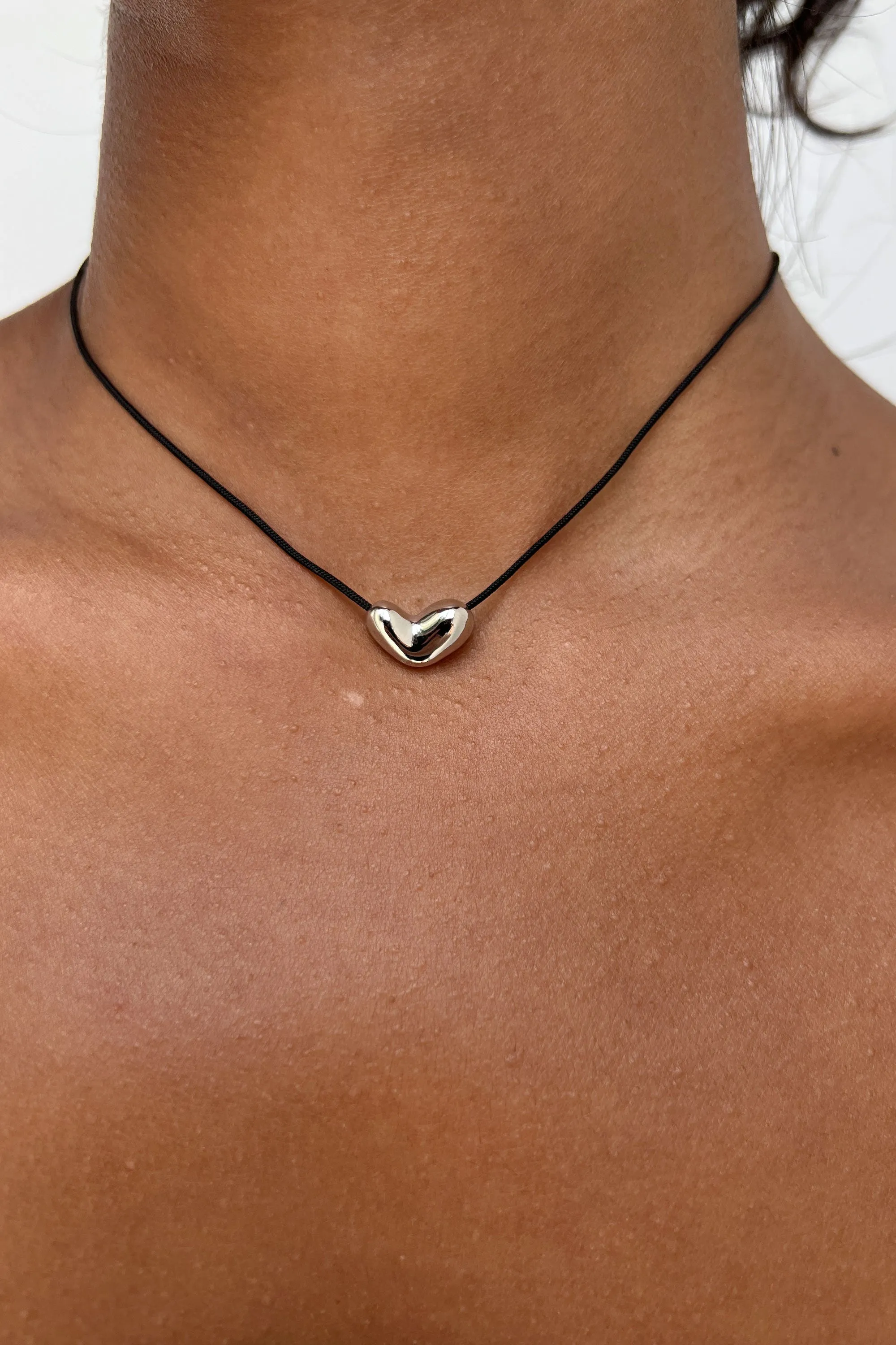 CORD NECKLACE WITH MINI HEART PENDANT sold by OAK AND FORT