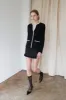 SUITING MINI SKIRT WITH RUFFLE HEM sold by OAK AND FORT