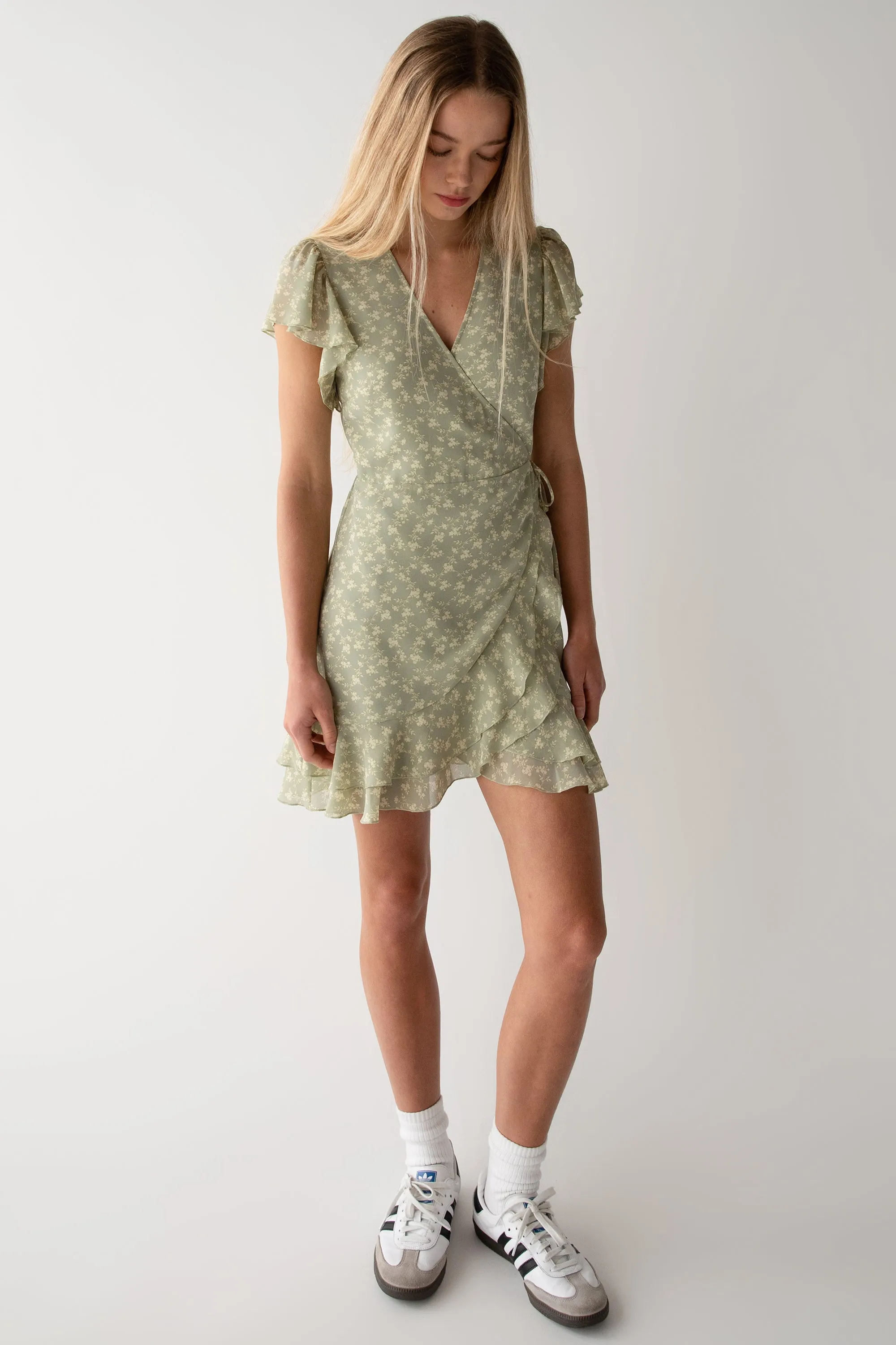 FLORAL WRAP MINI DRESS WITH RUFFLED HEM sold by OAK AND FORT