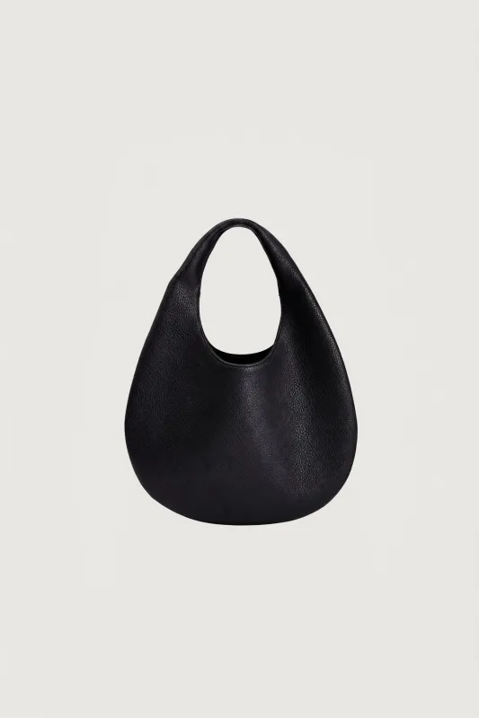 CURVED LEATHER HAND BAG made by OAK AND FORT