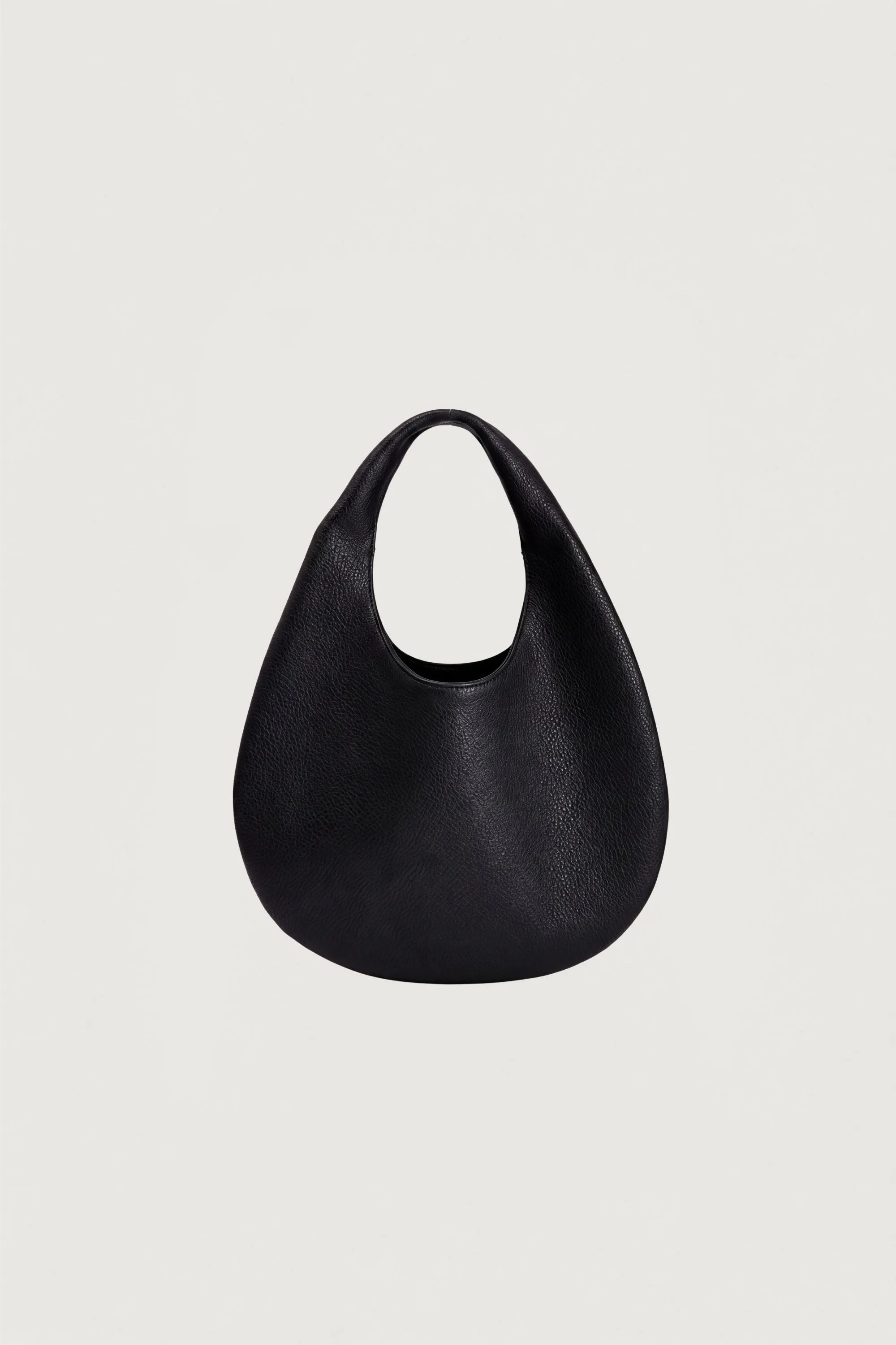 CURVED LEATHER HAND BAG sold by OAK AND FORT