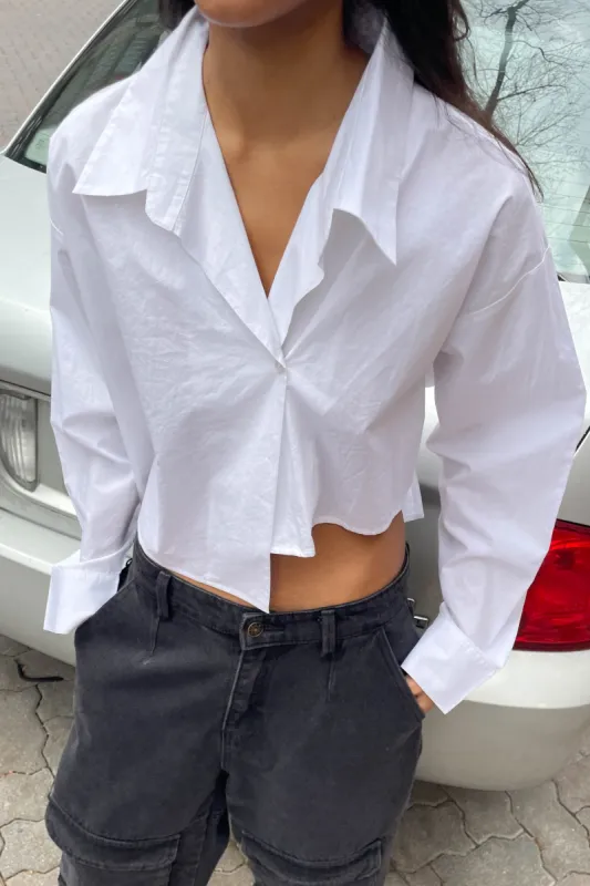 CROPPED ASYMMETRICAL HEM SHIRT sold by OAK AND FORT