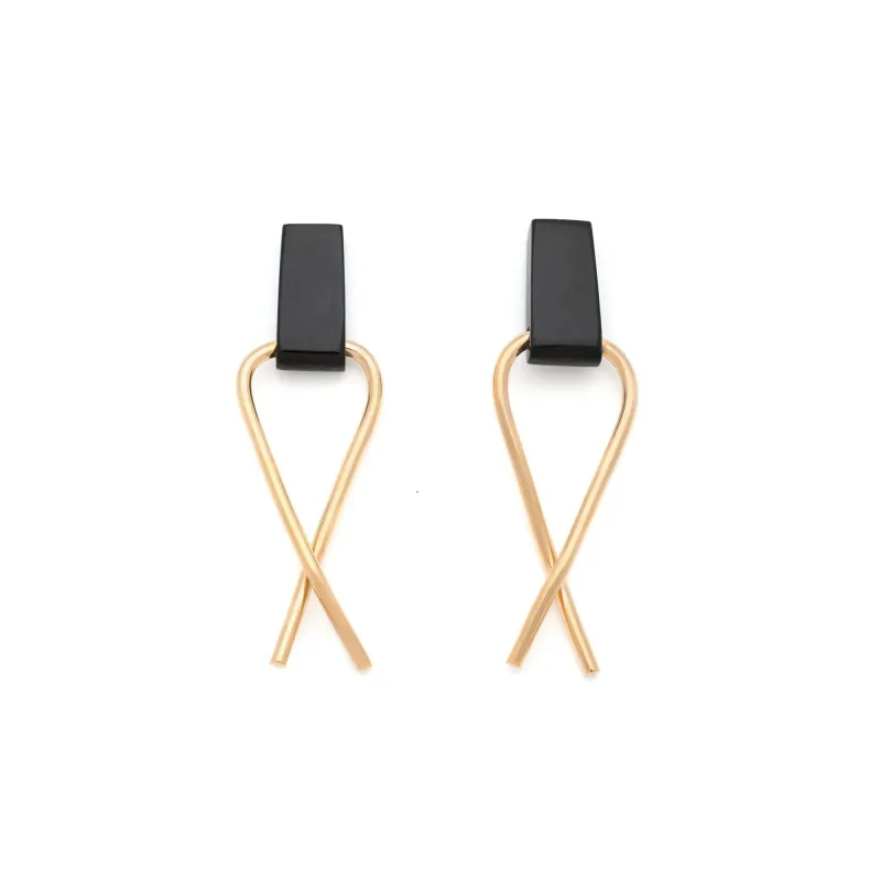 Cross-over Horn Earrings made by Obakki