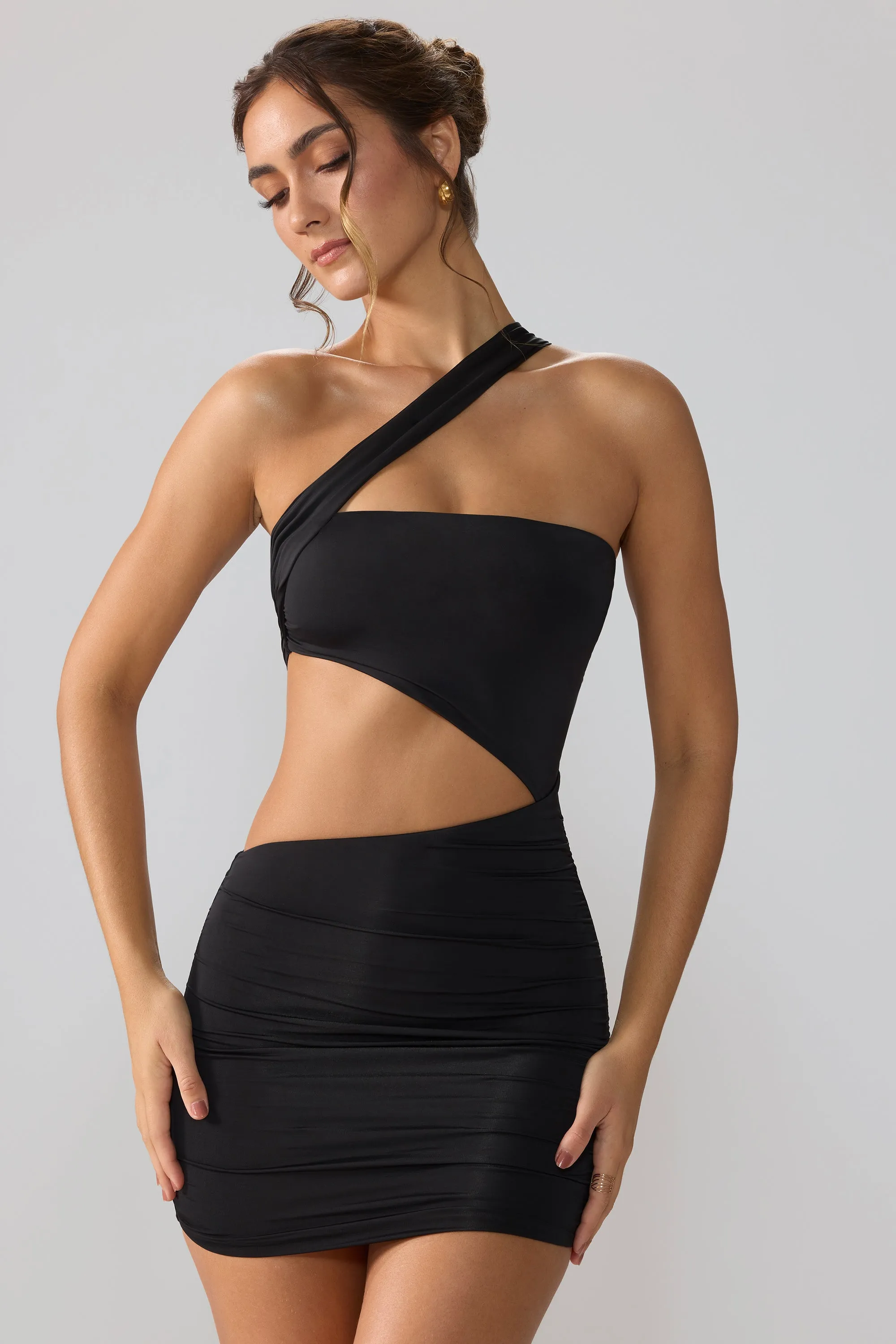 Slinky Jersey Ruched Cut Out Mini Dress in Black sold by Oh Polly