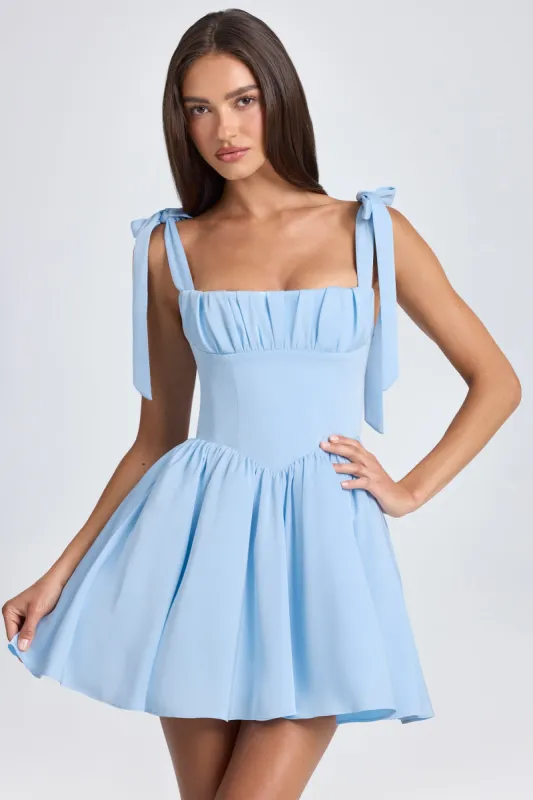 Draped Corset Mini Dress in Powder Blue sold by Oh Polly