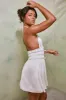 Halter Neck Cut Out Shirred Mini Dress in White sold by Oh Polly