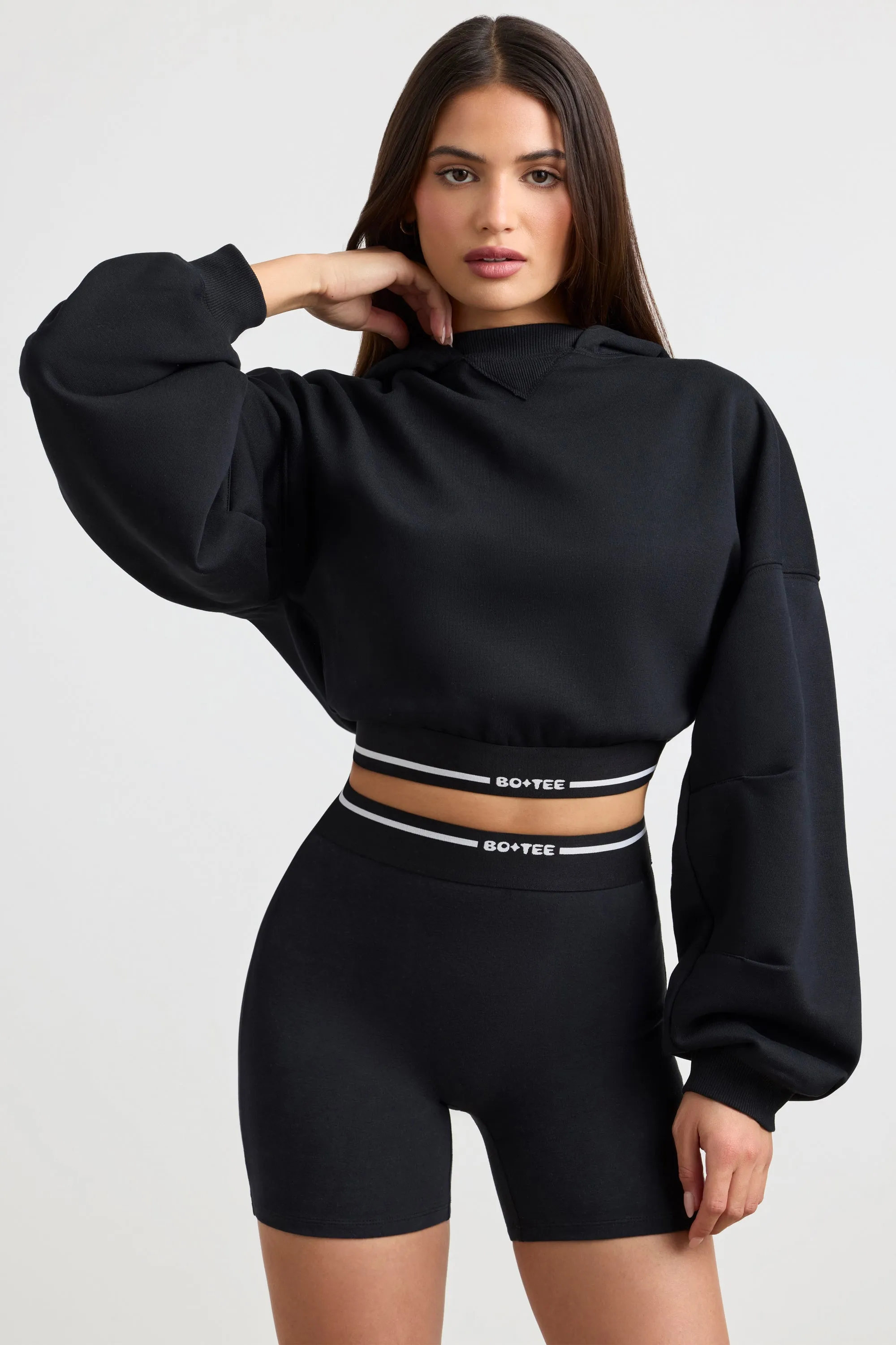 Stretch Cotton Fleece Cropped Hoodie in Black sold by Oh Polly