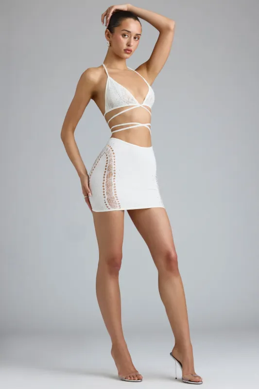 Embellished Mid-Rise Mini Skirt in Ivory sold by Oh Polly