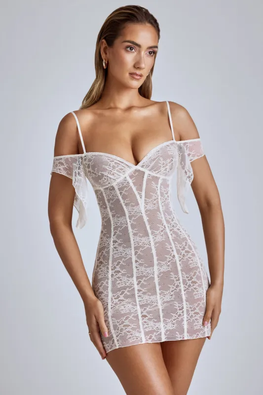 Sheer Lace A-Line Mini Dress in Ivory sold by Oh Polly