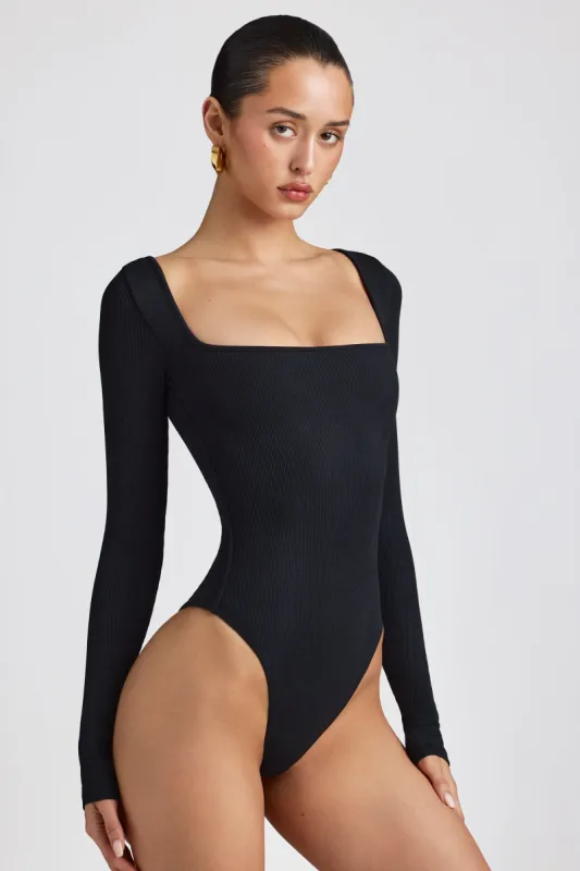 Ribbed Modal Long Sleeve Bodysuit in Black sold by Oh Polly
