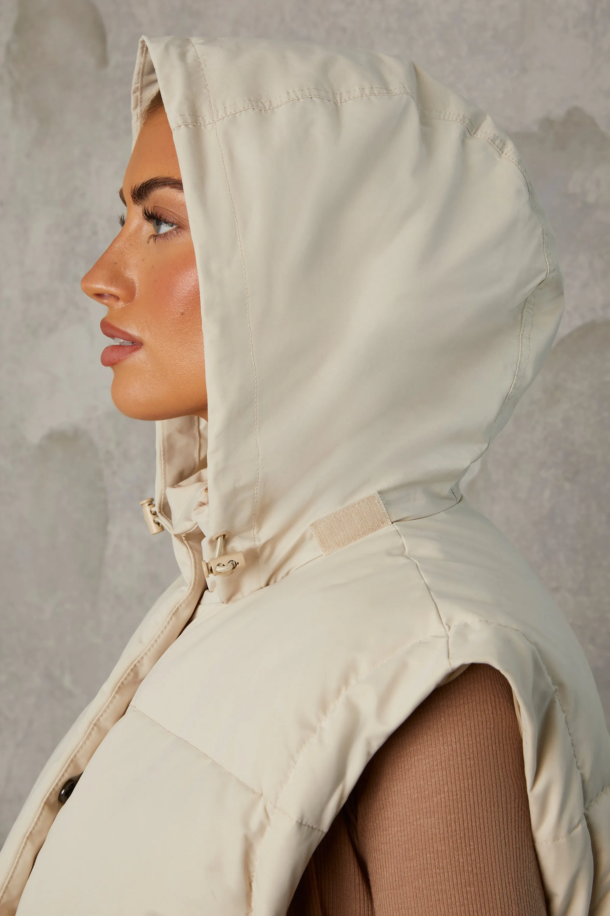 Cropped Puffer Jacket with Detachable Sleeves in Sand sold by Oh Polly product image thumbnail 4