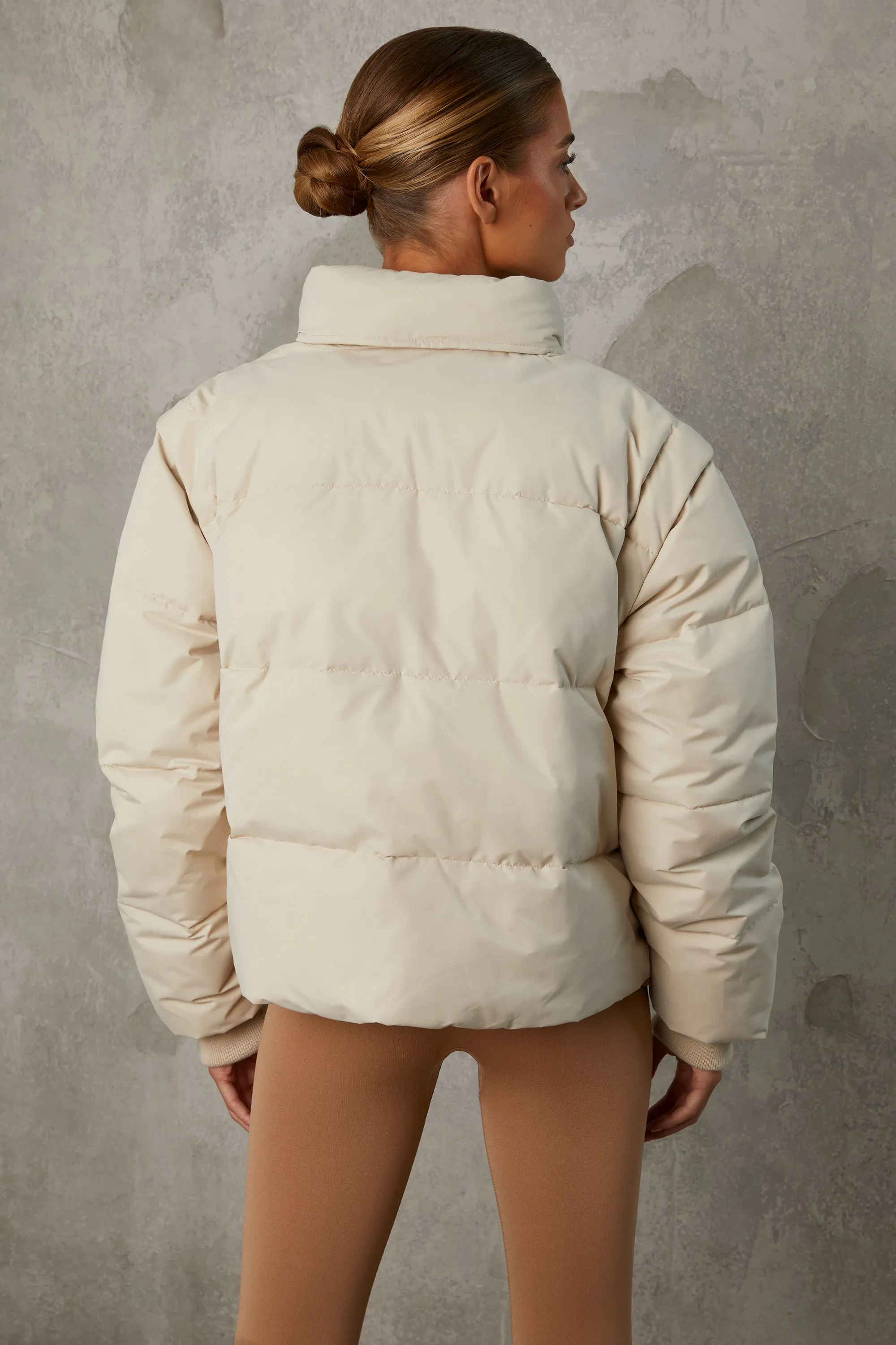 Cropped Puffer Jacket with Detachable Sleeves in Sand sold by Oh Polly product image thumbnail 2