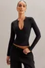 Long Sleeve Crop Top in Black sold by Oh Polly