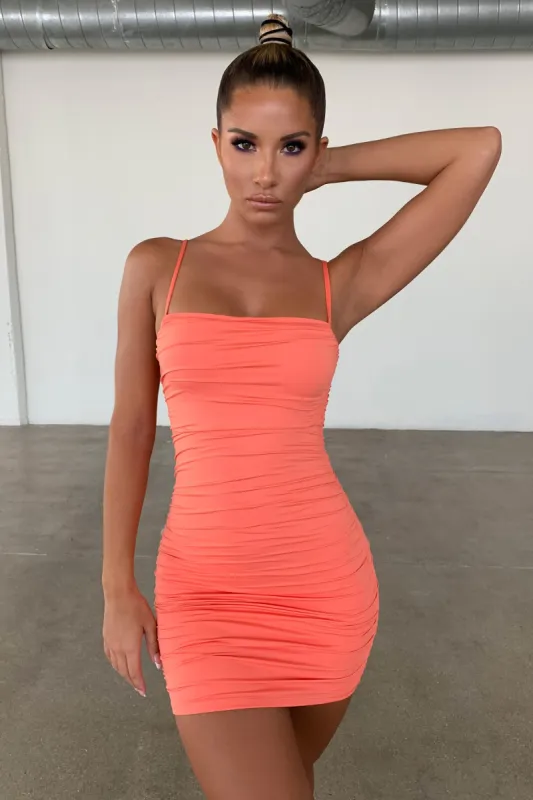 Bright Future Ruched Bodycon Strappy Mini Dress in Coral sold by Oh Polly