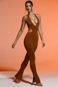 Petite Plunge Neck Cut Out Jumpsuit in Brown sold by Oh Polly