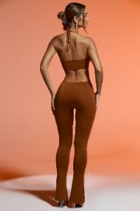 Petite Plunge Neck Cut Out Jumpsuit in Brown sold by Oh Polly