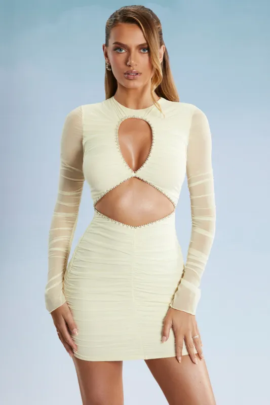 Long Sleeve Cut Out Mini Dress in Ivory sold by Oh Polly
