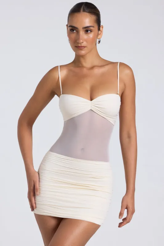 Sheer Panelled Ruched Mini Dress in Ivory sold by Oh Polly