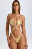 Cut-Out Halterneck Swimsuit in Metallic Gold sold by Oh Polly