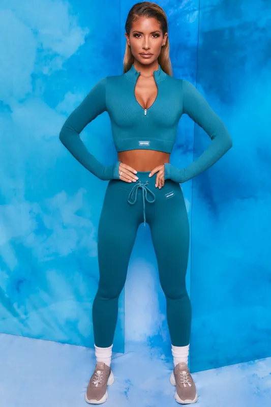 Endure Ribbed Long Sleeve Half Zip Crop Top in Teal sold by Oh Polly