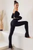 High Waist Split Flare Leggings in Black sold by Oh Polly