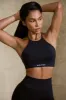 High Neck Open Back Define Luxe Sports Bra in Black sold by Oh Polly