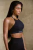 High Neck Open Back Define Luxe Sports Bra in Black sold by Oh Polly
