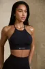 High Neck Open Back Define Luxe Sports Bra in Black sold by Oh Polly