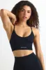 Super Sculpt Seamless Scoop-Neck Sports Bra in Black sold by Oh Polly
