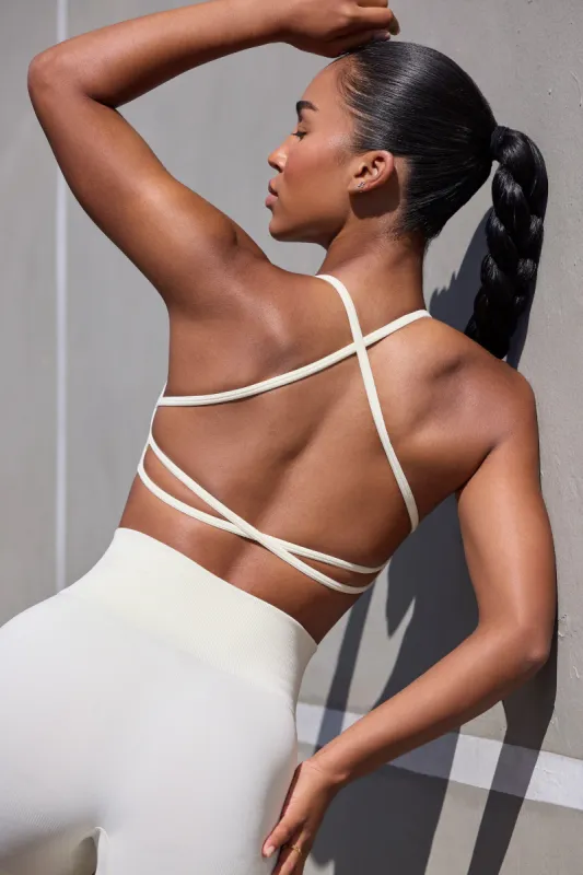Super Sculpt Seamless Open Back Sports Bra in Eggshell sold by Oh Polly