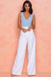 Thrill Wide High Waisted Flared Wide Leg Trousers in White sold by Oh Polly