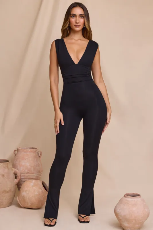 Petite Plunge Neck Ruched Waist Jumpsuit in Black sold by Oh Polly