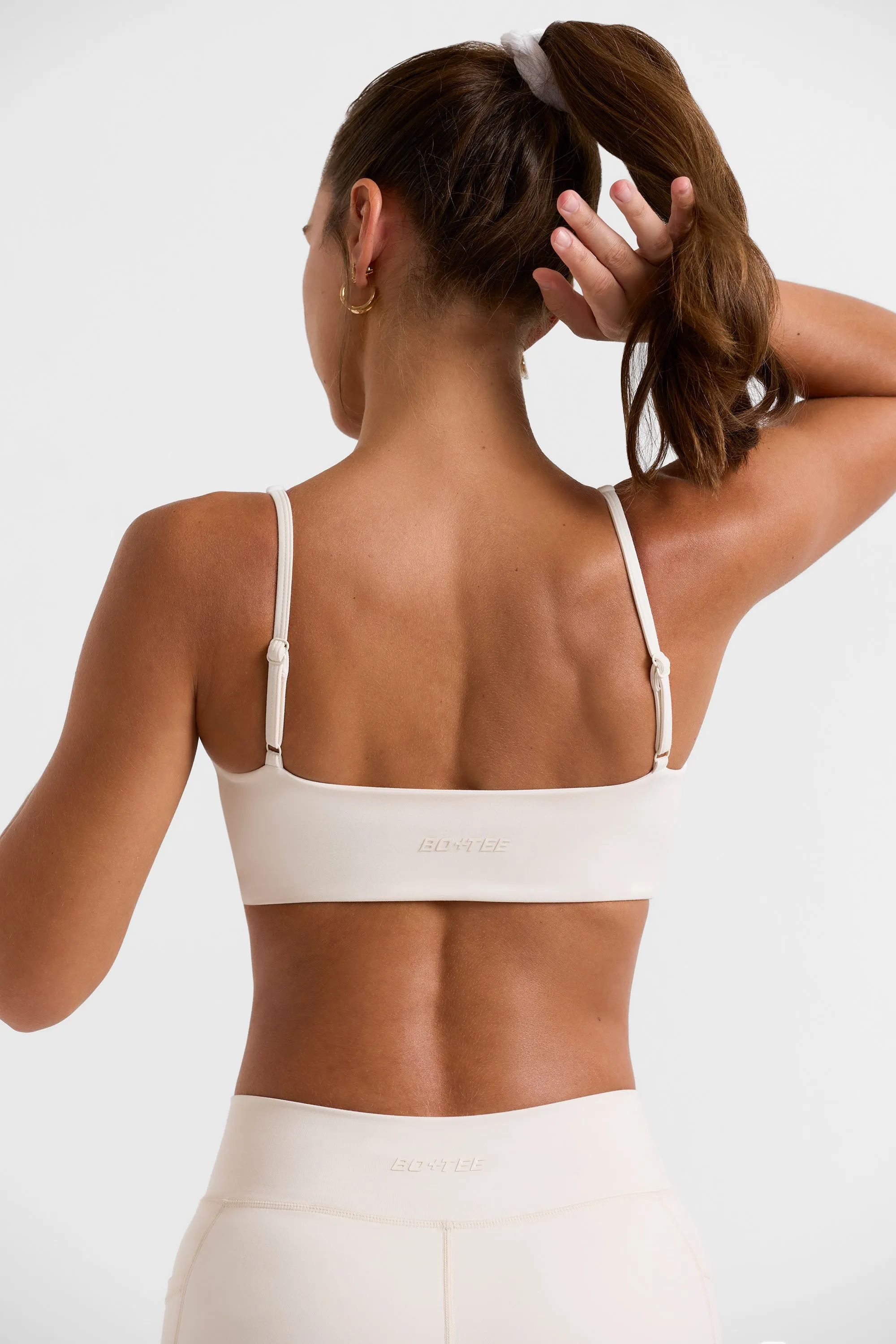 Twist Bust Sports Bra in White sold by Oh Polly product image thumbnail 2