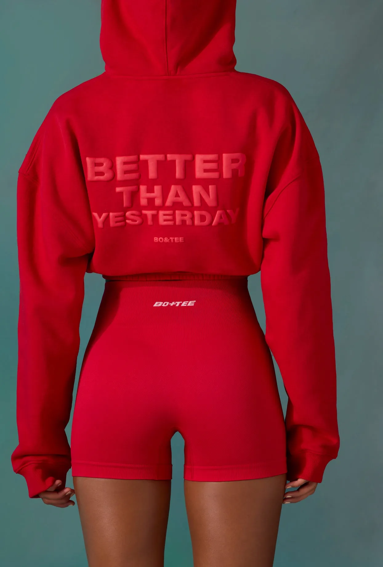 Cropped Drawstring Hooded Sweatshirt in Tango Red sold by Oh Polly product image thumbnail 2