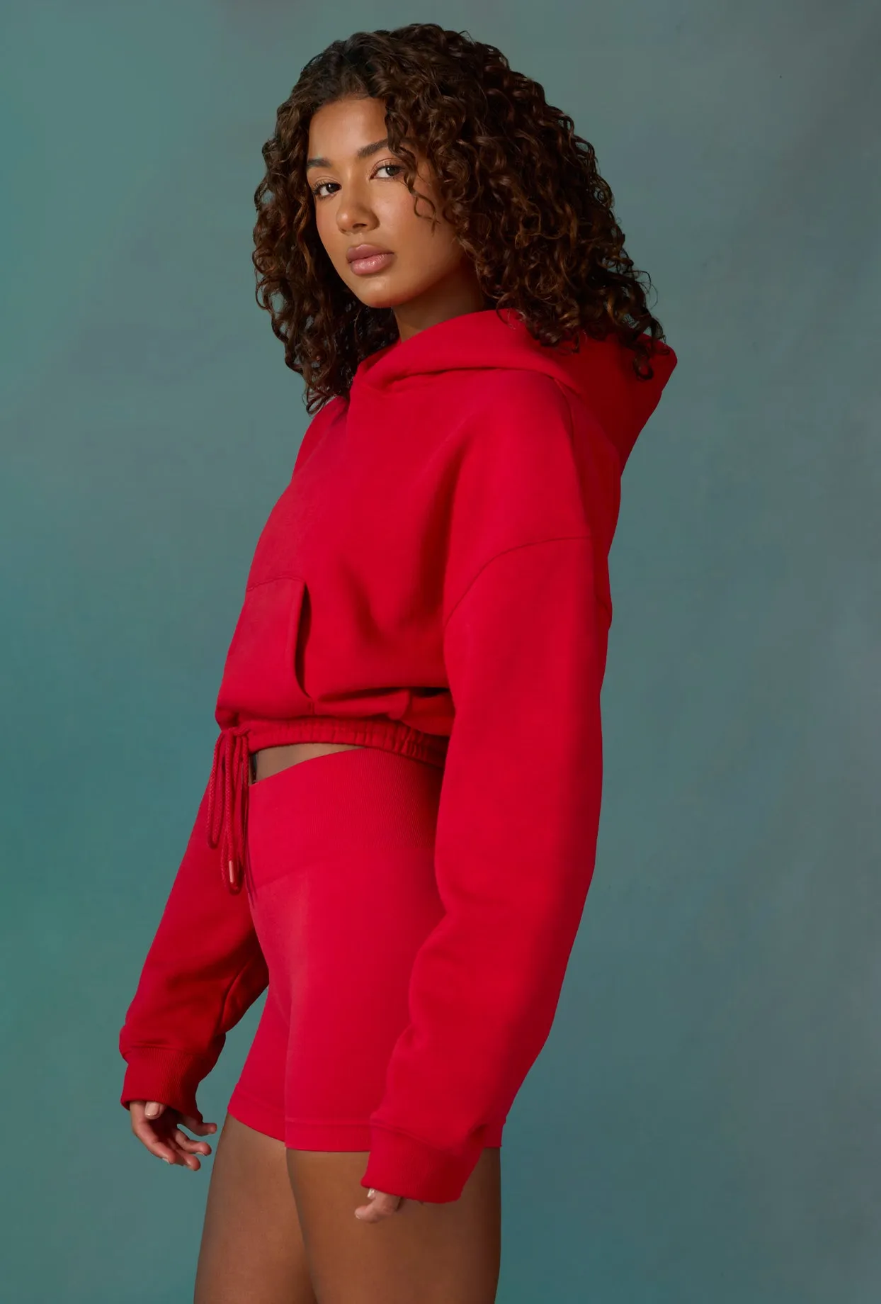 Cropped Drawstring Hooded Sweatshirt in Tango Red sold by Oh Polly product image thumbnail 3
