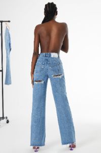 Ultra Distressed Wide Leg Jeans in Medium Blue Wash sold by Oh Polly