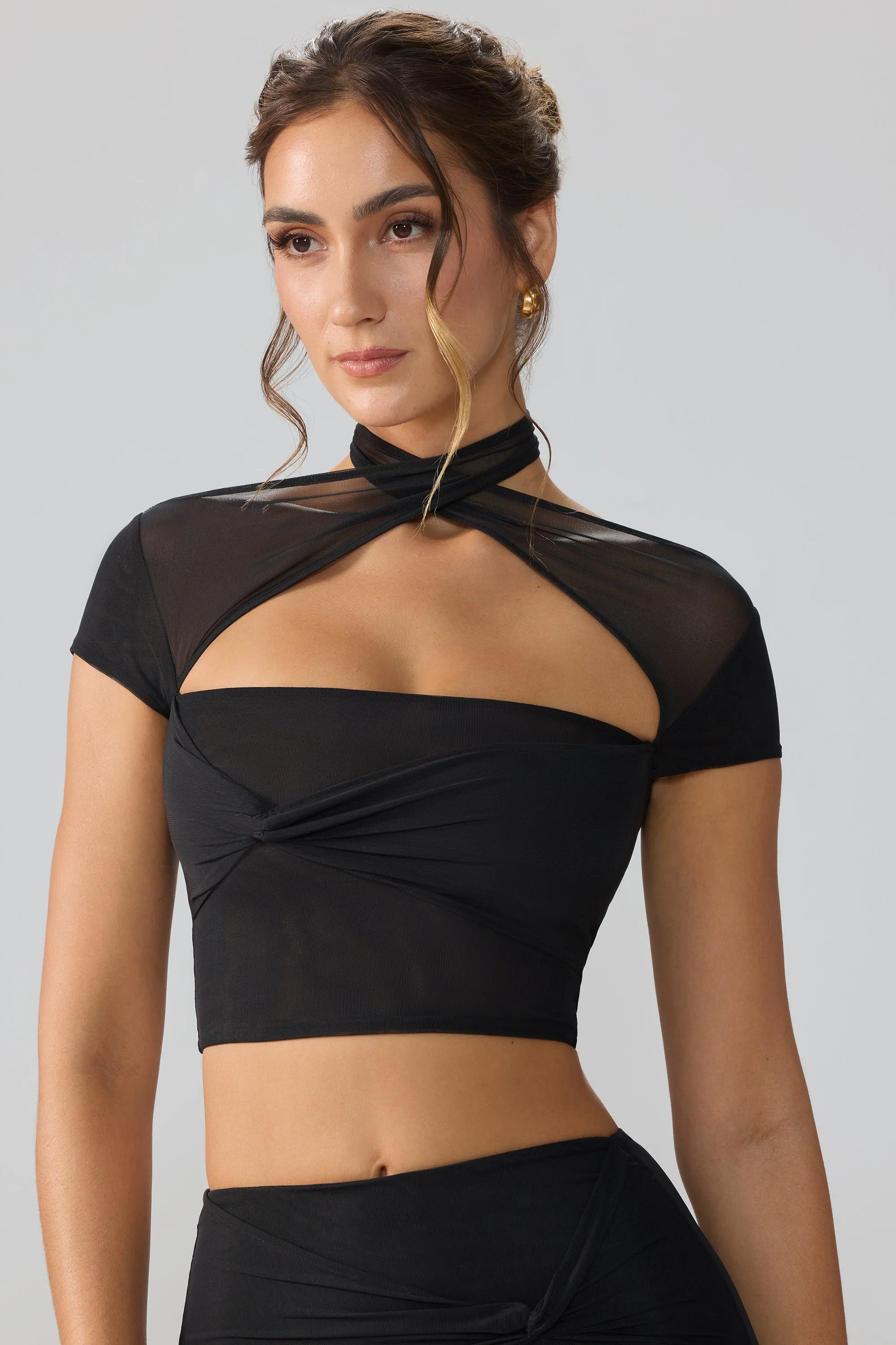 Mesh Cap Sleeve Cut Out Crop Top in Black sold by Oh Polly