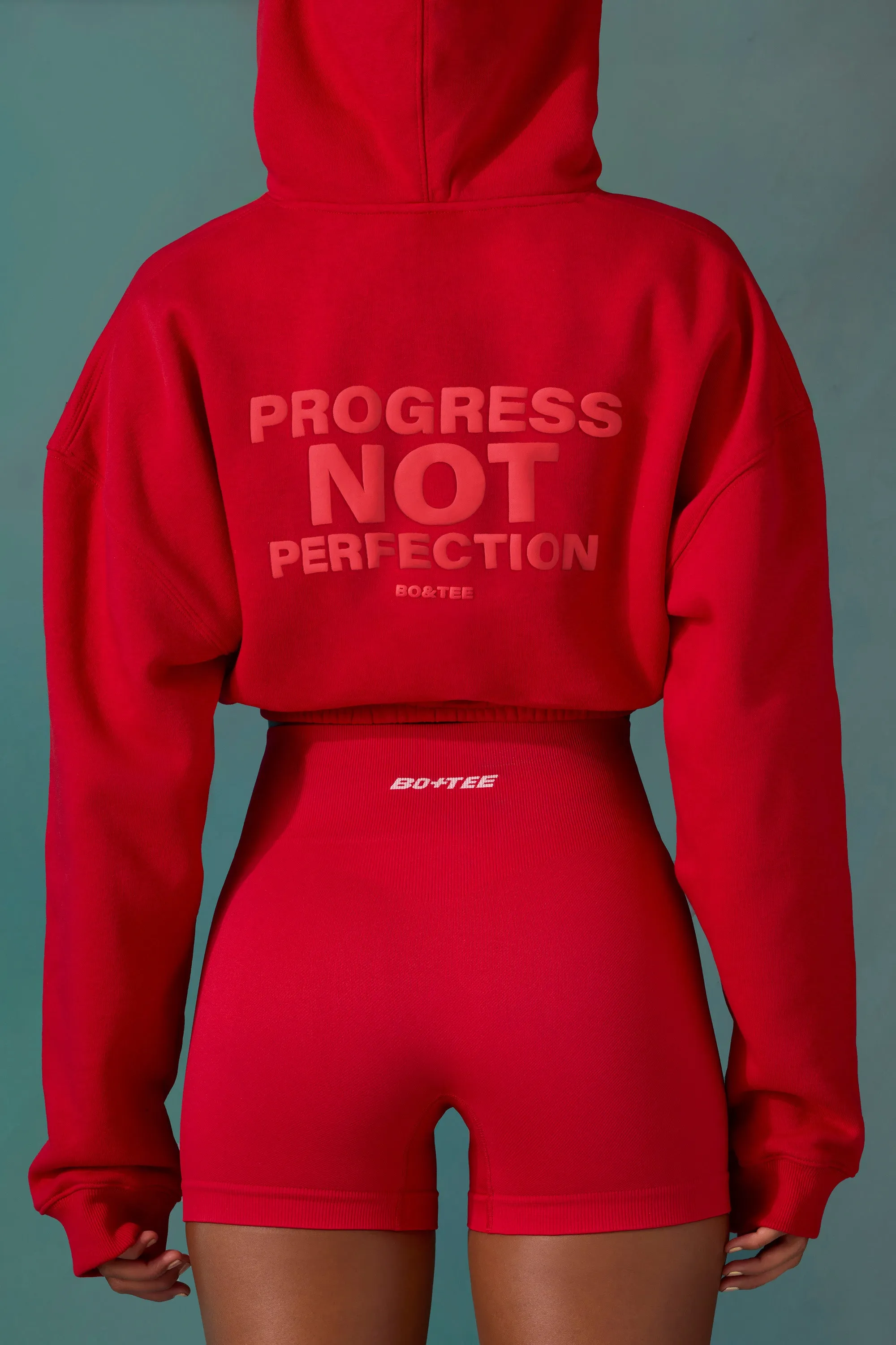 Cropped Drawstring Hooded Sweatshirt in Tango Red sold by Oh Polly product image thumbnail 2