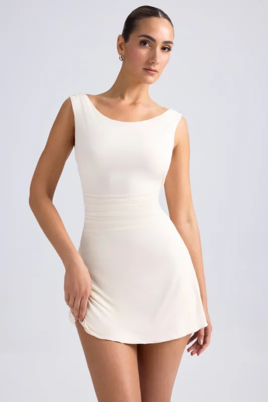 Off-Shoulder Cowl-Back A-Line Mini Dress in Ivory sold by Oh Polly