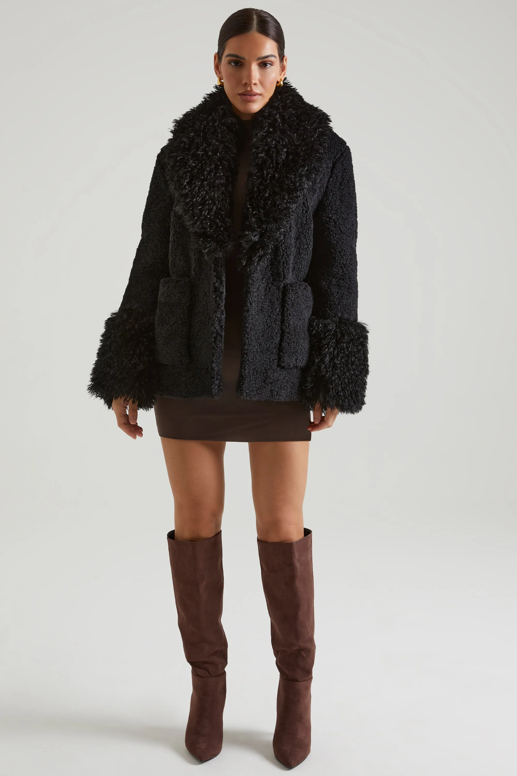 Shearling Coat with Large Front Pockets in Black sold by Oh Polly