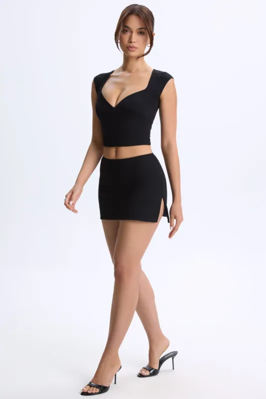 Mid-Rise Micro Mini Skirt in Black sold by Oh Polly