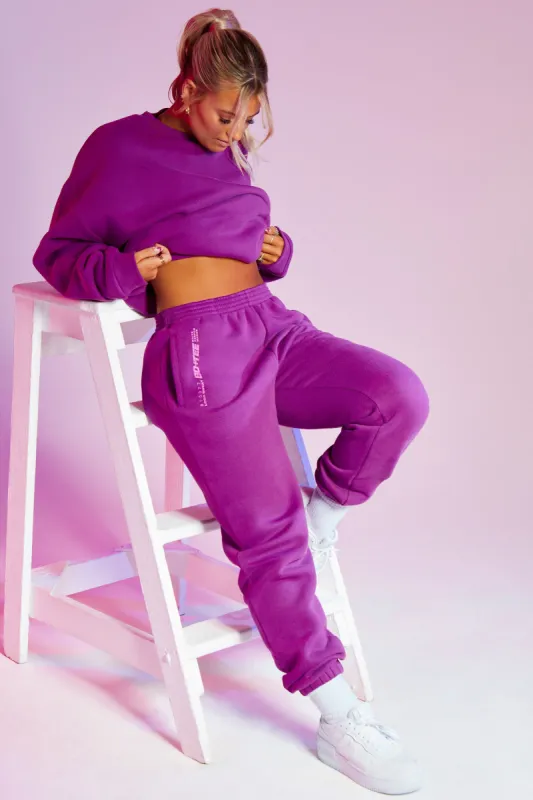 Cool Down Full Length Loose Fit Joggers With Branding in Purple sold by Oh Polly