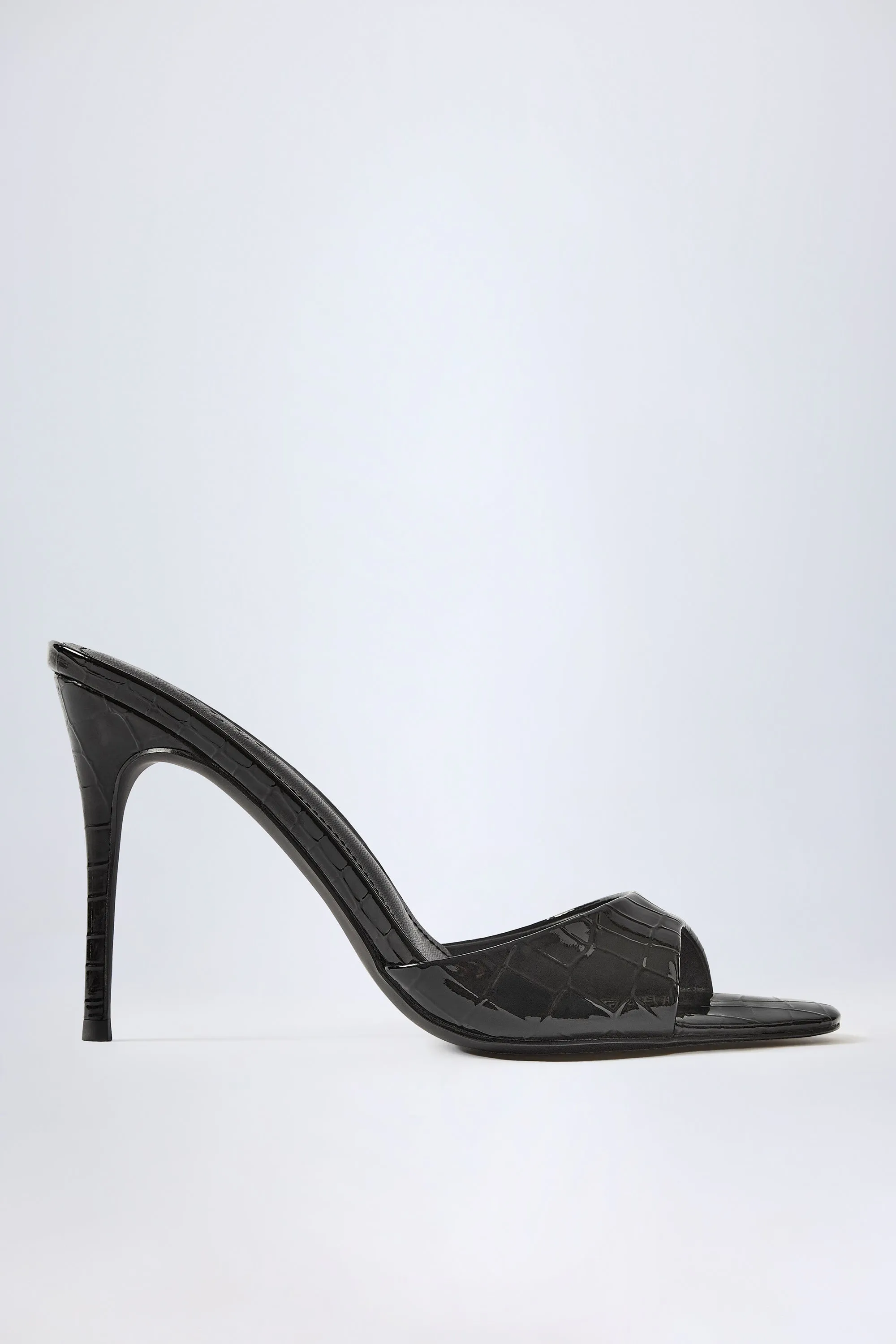Almond-Toe Heeled Mules in Croc Patent Black sold by Oh Polly