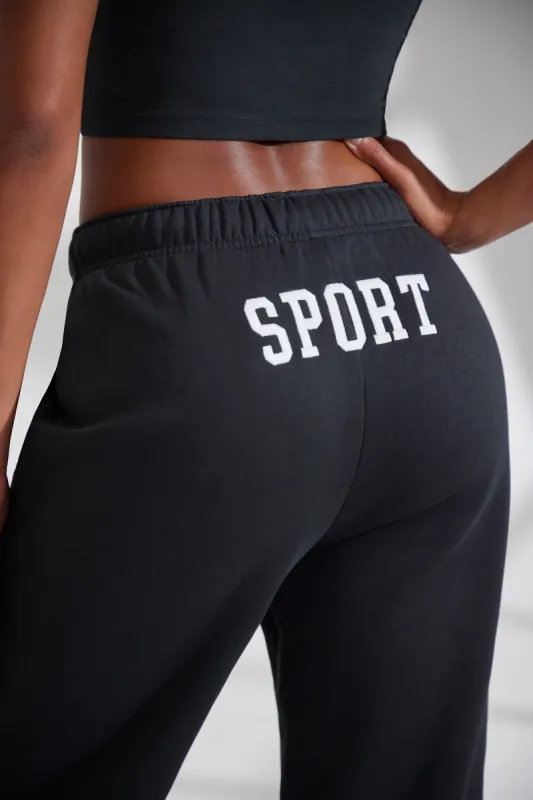 Wide Leg Embroidered Back Joggers in Black made by Oh Polly