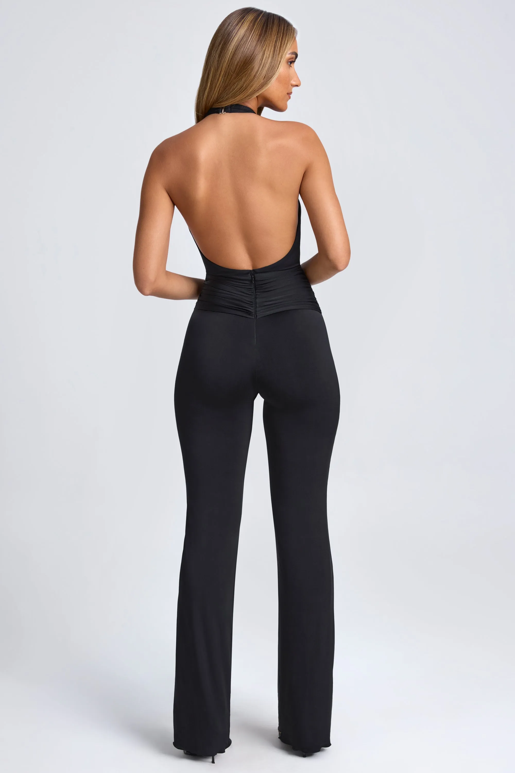 Hardware Detail Plunge Halterneck Jumpsuit in Black sold by Oh Polly product image thumbnail 2