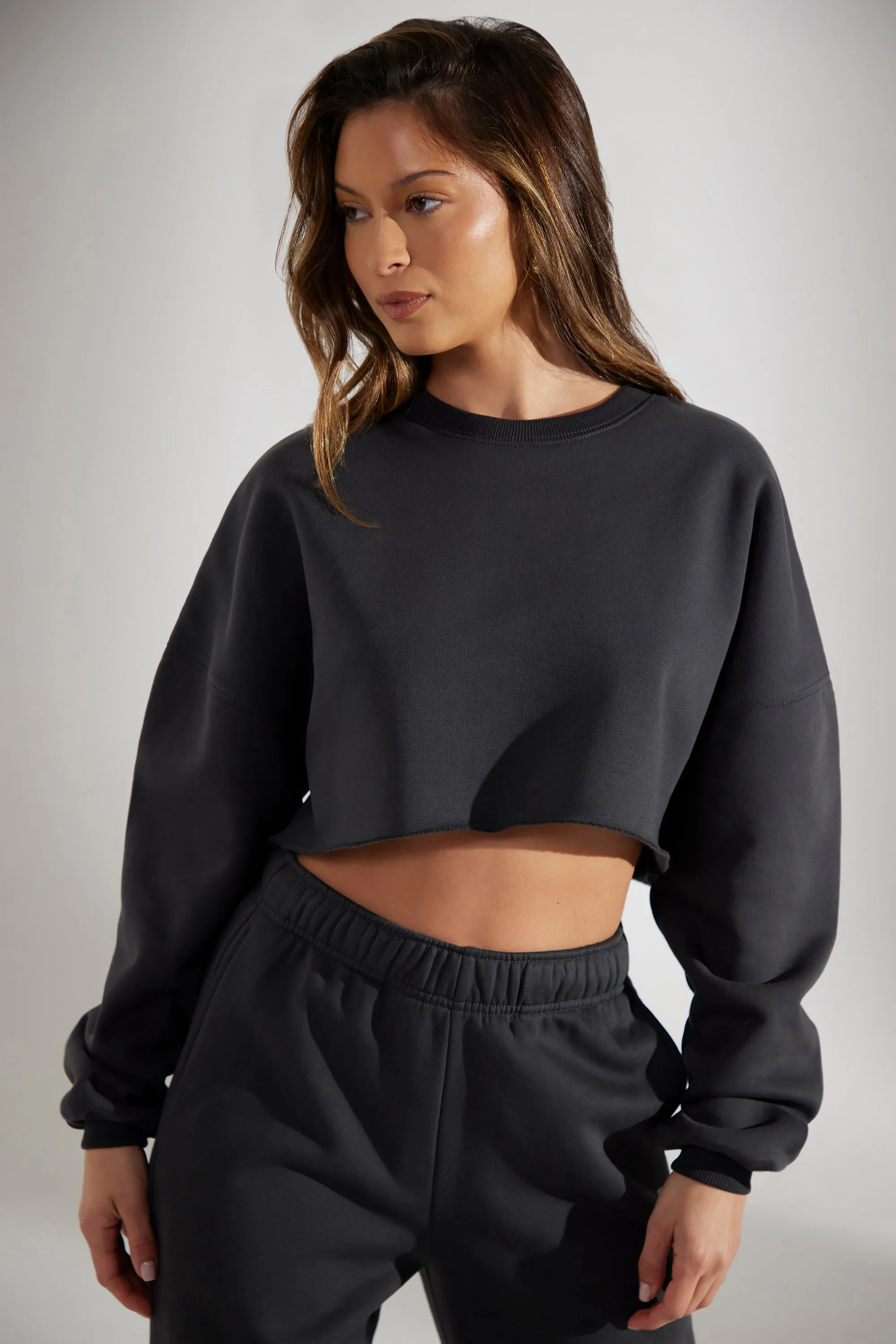 Cropped Oversized Sweatshirt in Washed Black sold by Oh Polly