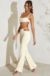 Petite Twist Strap Cut Out Flare Trousers in Ivory sold by Oh Polly