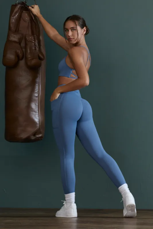 Petite High Waist Wrap Over Leggings in Blue sold by Oh Polly