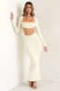 Cut Out Back Long Sleeve Crop Top in Ivory sold by Oh Polly